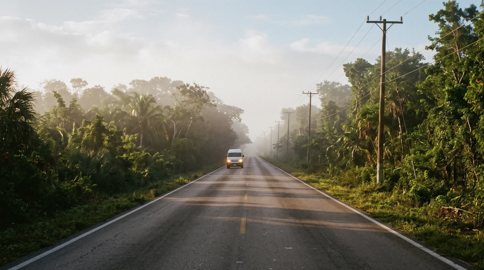 Straight jungle highway heading inland for a day trip from Tulum at sunrise, Tulum Mexico
