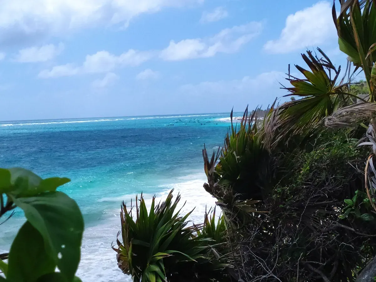 White sand and turquoise shallows on the public beach at Tulum, Quintana Roo, Mexico